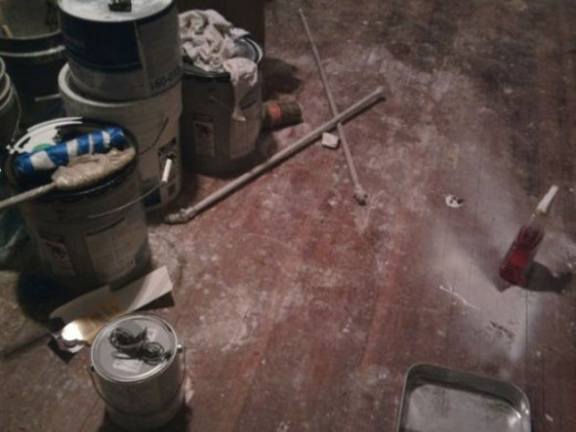 The floors were a mess after the workers had been in the house so long.
