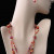 This two-strand necklace with a dichroic art class focal pendant and matching earrings combine rare vintage glass and metal beads with contemporary glass and crystal beads in a summery palette of pinks and oranges in a gorgeous mix of hues. This two-strand necklace with a dichroic art class focal pendant and matching earrings combine rare vintage glass and metal beads with contemporary glass and crystal beads in a summery palette of pinks and oranges in a gorgeous mix of hues.