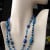 My "Pacific Blues" necklace and earrings set features a dichroic glass pendant and two strands of vintage and contemporary glass beads, some dichroic. My "Pacific Blues" necklace and earrings set features a dichroic glass pendant and two strands of vintage and contemporary glass beads, some dichroic.