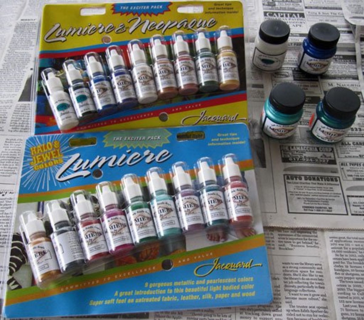 Photo of Jacquard Lumiere and Neopaque acrylic paint exciter packs