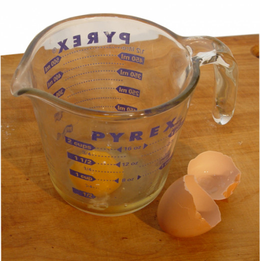 Crack the egg into a large measuring cup.