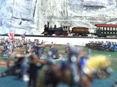 My N Scale Train Chugging By Embattled Troops