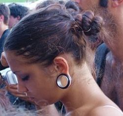 Young woman with stretched ears