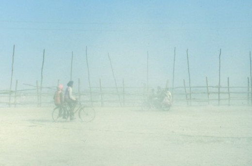 Riding bikes through the dusty mela grounds