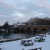 Newbridge where the River Windrush meets the River Thames winter snow cover the Maybush Inn garden