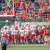 Football players lift Jack Hoffman on their shoulders after he makes a touchdown during the spring game.