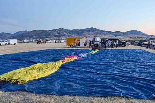 The balloon is stretched out on a tarp in preparation for inflation