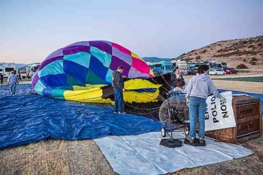 A fan begins to fill the balloon with air
