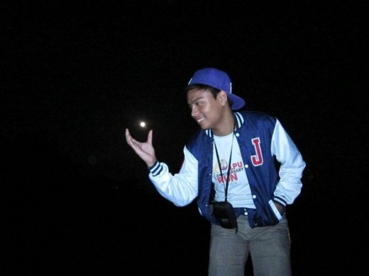 My cousin Jed tries to grab the moon like Gru in despicable me