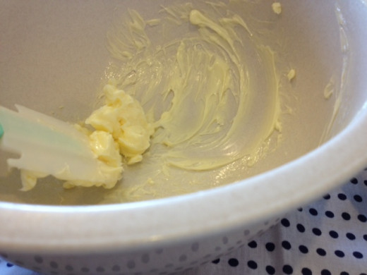 In a separate bowl, mix the softened butter with spatula until smooth.