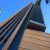 Skyscrapers filled with office workers in suits and aloha shirts.