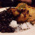 Fricase de Pollo, marinated chicken sauteed with onions and spanish olives, served over arroz blanco with frijoles negros and platanos maduros.