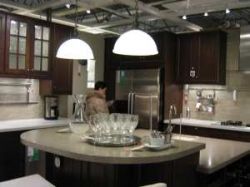 Large kitchen island with pendant lights overhead