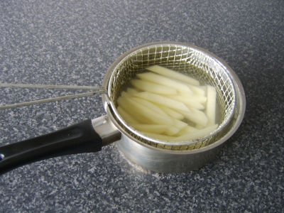 The Chopped Potatoes are Firstly Parboiled in Salted Water