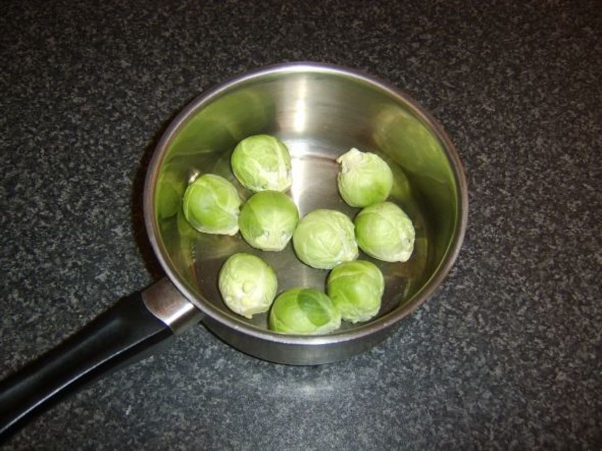 Brussels sprouts are added to a pot with salted, boiling water