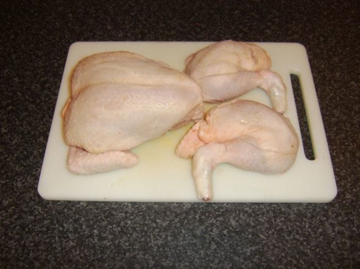 Leg and thigh portions removed from the chicken