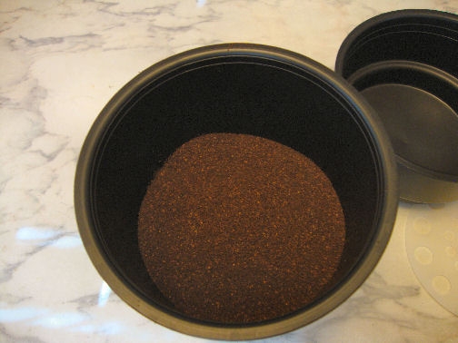 Add the grounds according to instructions. We use 12 ounces of coffee for 6 cups of water.