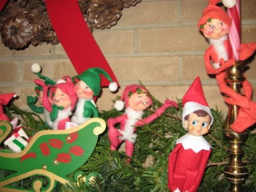 Elf on the Shelf Photo: I have lots of elfs on our mantle so Nuke claimed them as his kin and here he is visiting with some cousins. 