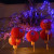 Hanging in The Sussex Arts Club, 7 Ship Street, Brighton. Made up of Paper Chinese Lanterns and festooned with blue LEDs