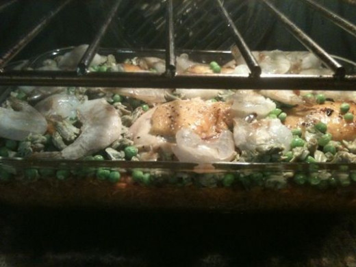 After the first stage of baking, I've added the peas, shrimp and clams.