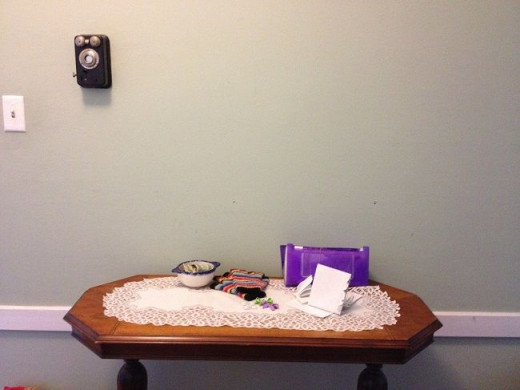 Before: Our plain, cluttered entry table, not at all welcoming