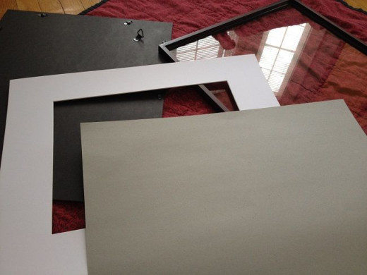 Step 2. Carefully disassemble the frame. Save the backing and matting, as you will use them in this project. 