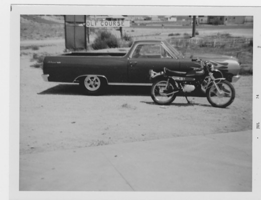 This is an El Camino that he customized.  The motorcycle is a Yamaha.  Remember these motorcycles?