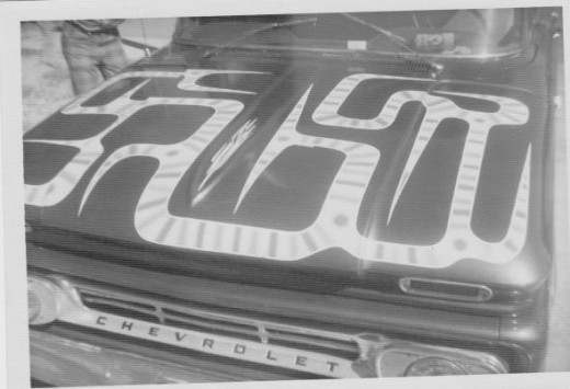 Classic design on the hood of an old Chevy truck (Purple).