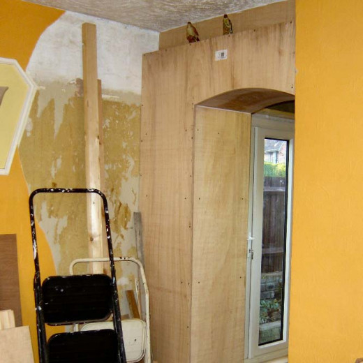 Back view of built in larder under construction as seen from the dining room