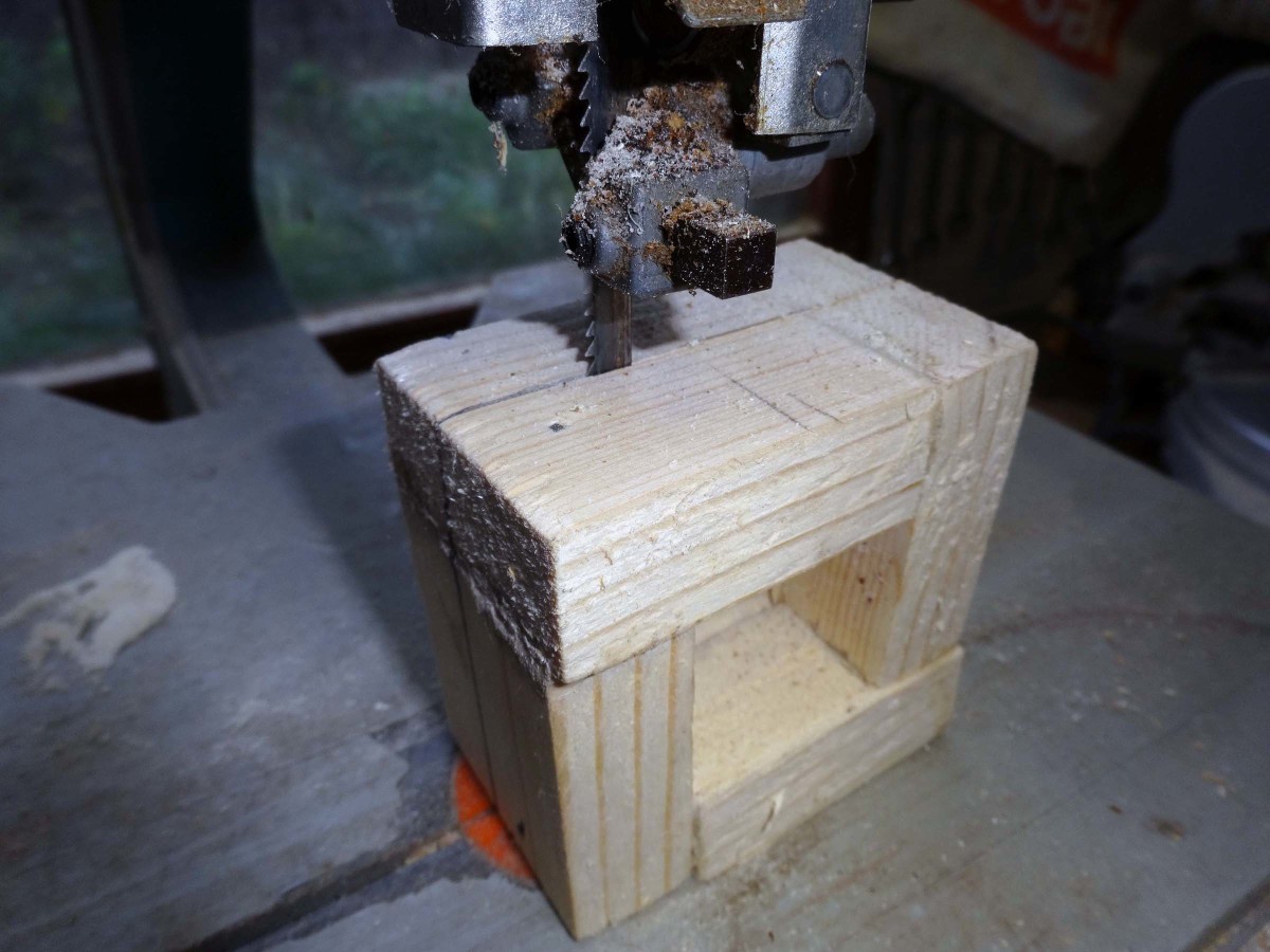 Cutting the wooden tube into small square.