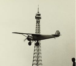 The new invention, the aeroplane, flew around the Eiffel Tower
