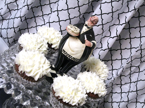 Close up of maitre'd and cupcakes