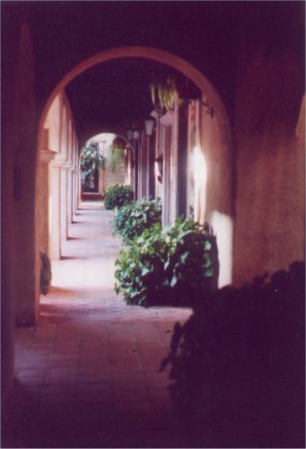 Covered walkway with arched entrances.
