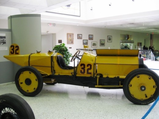 This is the winner of the first Indianapolis 500 Mile Race in 1911. It's a Marmon-Wasp driven by Ray Harroun. It featured the first known rearview mirror and saved weight by eliminating the riding mechanic. Marmon was a car manufacturer in Indianapol