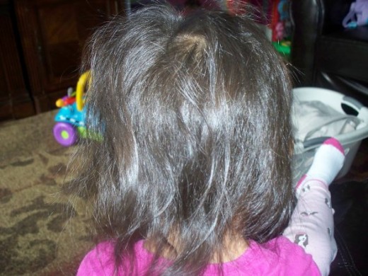 As you can see my daughter has very thin hair so I will be using a sock to add volume to this hairstyle.