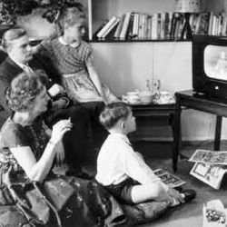 Family watching television in the 1960s