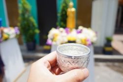 Scented water being offered at a Buddhist temple 