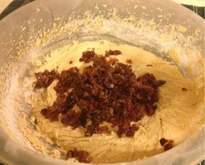 Add Dry Ingredients Slowly to the Mixture and Mix Thoroughly. Then Stir in Candied Bacon.