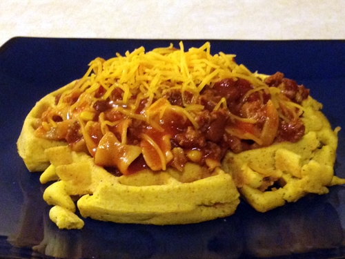 Place 2 scoops of chili on the cornbread waffle and top with shredded sharp cheddar cheese. Then dig in and prepare to be amazed!