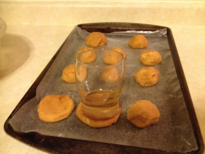 Step Fourteen:  Flatten Dough Balls with a Wet Glass Dipped in the Sugar Coating.