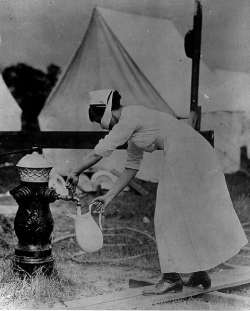 Influenza nurse getting water.