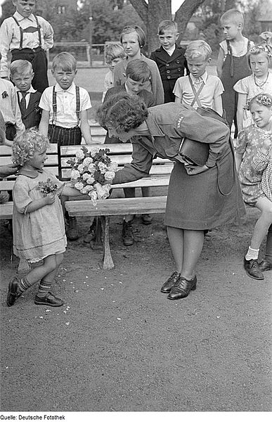 A German mother celebrates a gift from her little girl, time unknown. (All photos are public domain from Wikimedia Commons.)