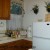 The kitchen with fridge and sink and stove The kitchen with fridge and sink and stove