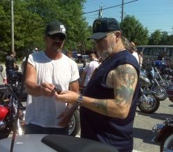 My husband exchanging emails at a bike event.