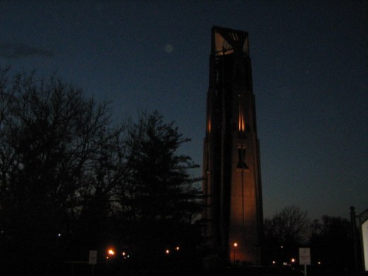 Night view of Moser Tower and Millennium Carillon in Riverwalk Park in downtown Naperville