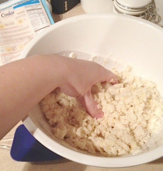 I like to use my hands to make the dough soft.