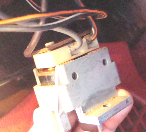 The red wire lowers top when 12V is applied. The other wire provides 12V to switch.
