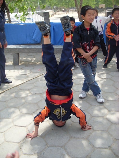 A young boy showing off his Kung Fu skills.