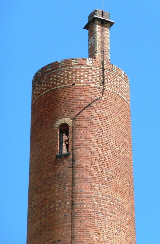 photo abandoned Abbotsford brick shot tower broken window