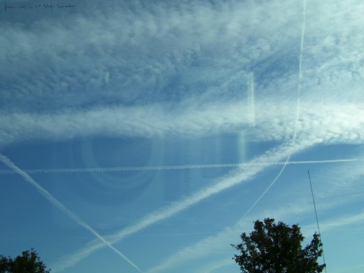 The several chemtrails seen here in October 2008 may or may not have stressors on our immunity. The very expanded ones at the top did so particularly rapidly. The tiny lines of the newer ones will likely look about the same  later.  Taken north OKC f
